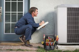 technician checking on hvac system