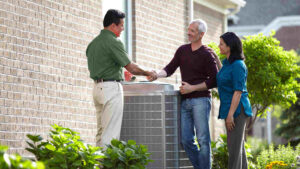 Dealer Handshake With Couple Carrier