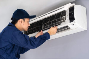 technician service removing air filters air conditioner cleaning