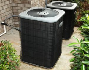 Residential Central Air Conditioning Units On Cement Slab