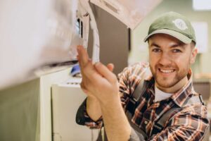 HVAC technician doing air conditioner service