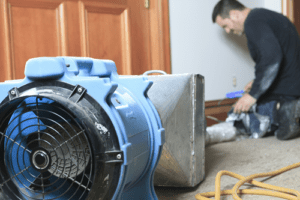 HVAC Technician Cleaning Air System