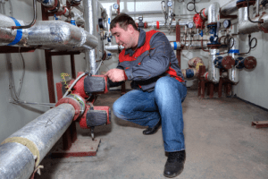 Technician repairing commercial heating systems