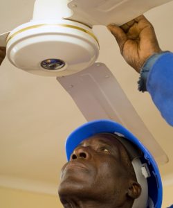 Construction Worker Fixing Ceiling Fan