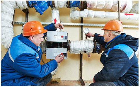 HVAC professionals configuring HVAC