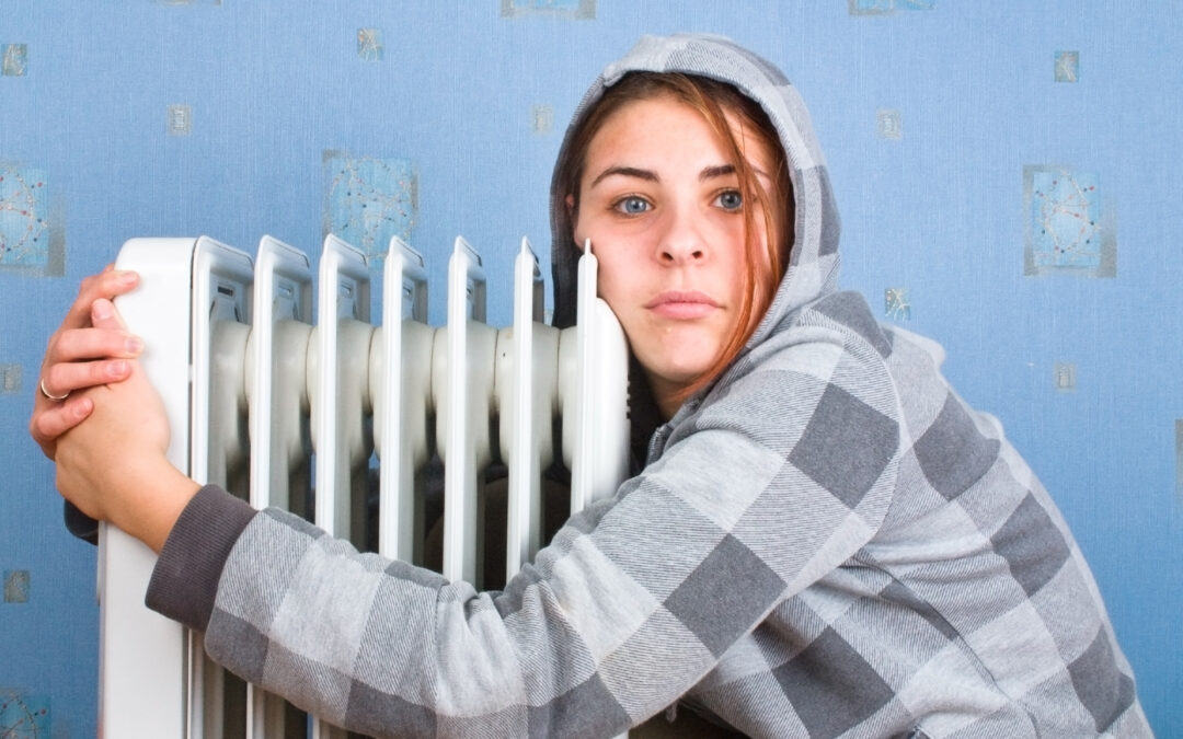 The freezing girl about a heater